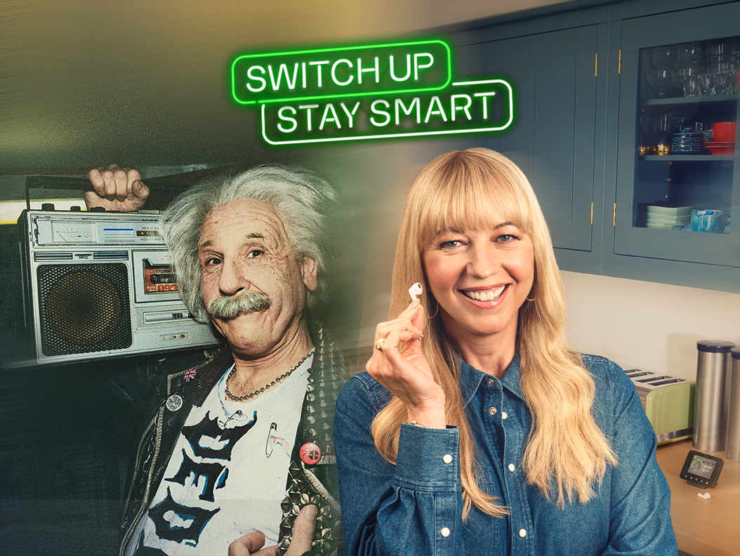 Albert Einstein with a boombox over his shoulder next to Sara Cox with an earbud in her hands. Demonstrating that all technology goes through upgrades, much like smart meters